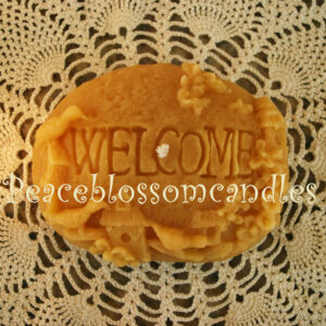 beeswax candle welcome rock